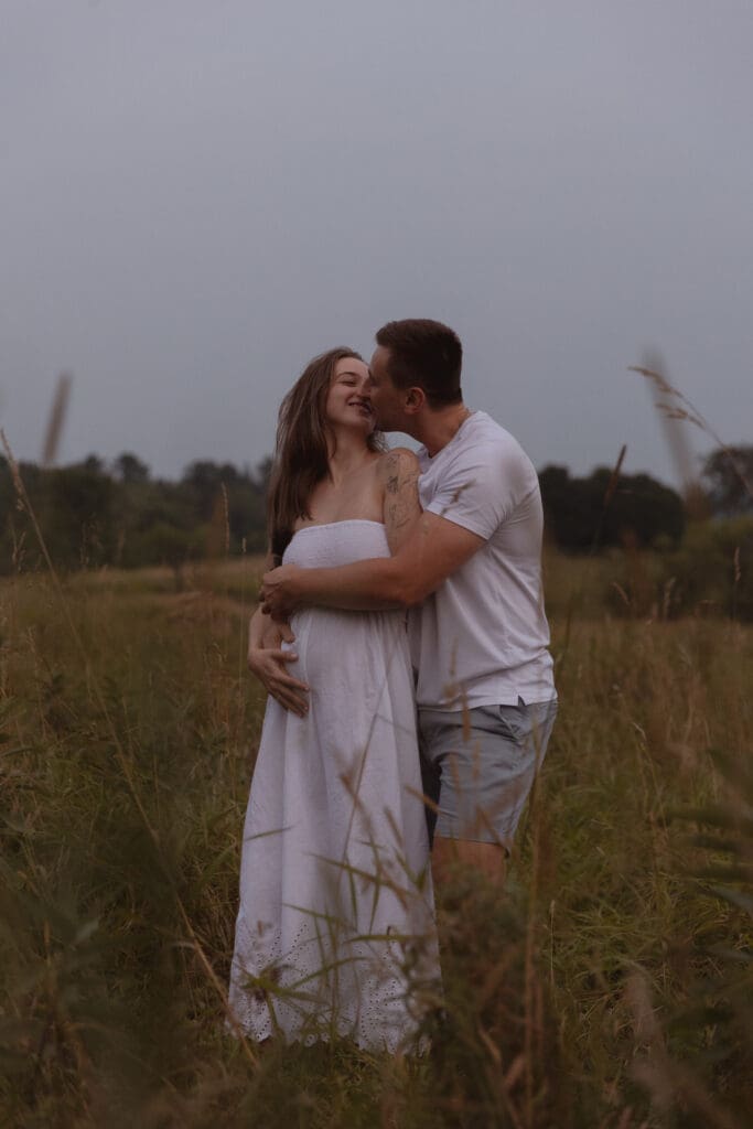 A couple embracing in Gatineau Park, Ottawa.