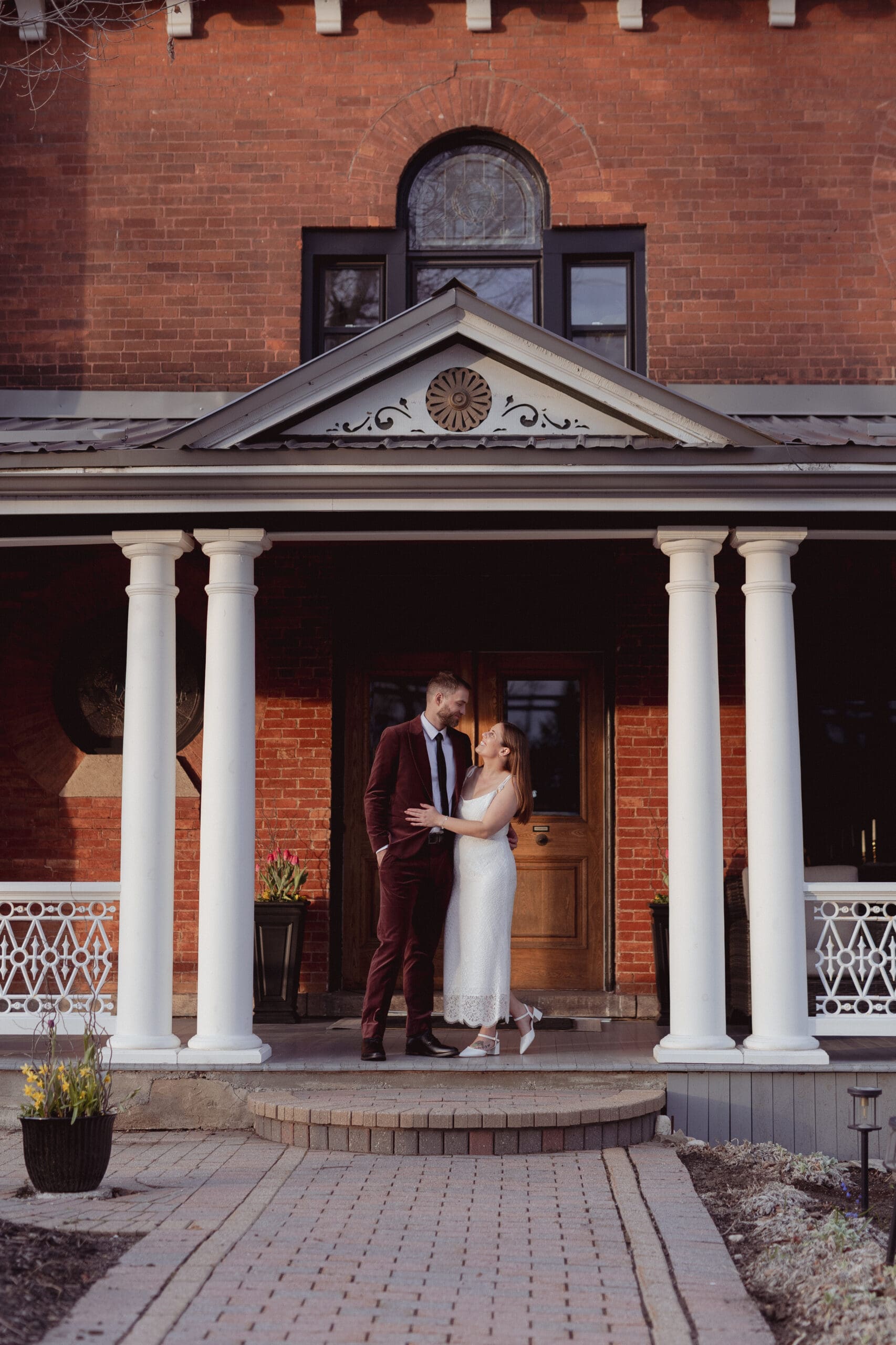 The bride and groom out front of Maple & Rose in Merrickville, Ontario.