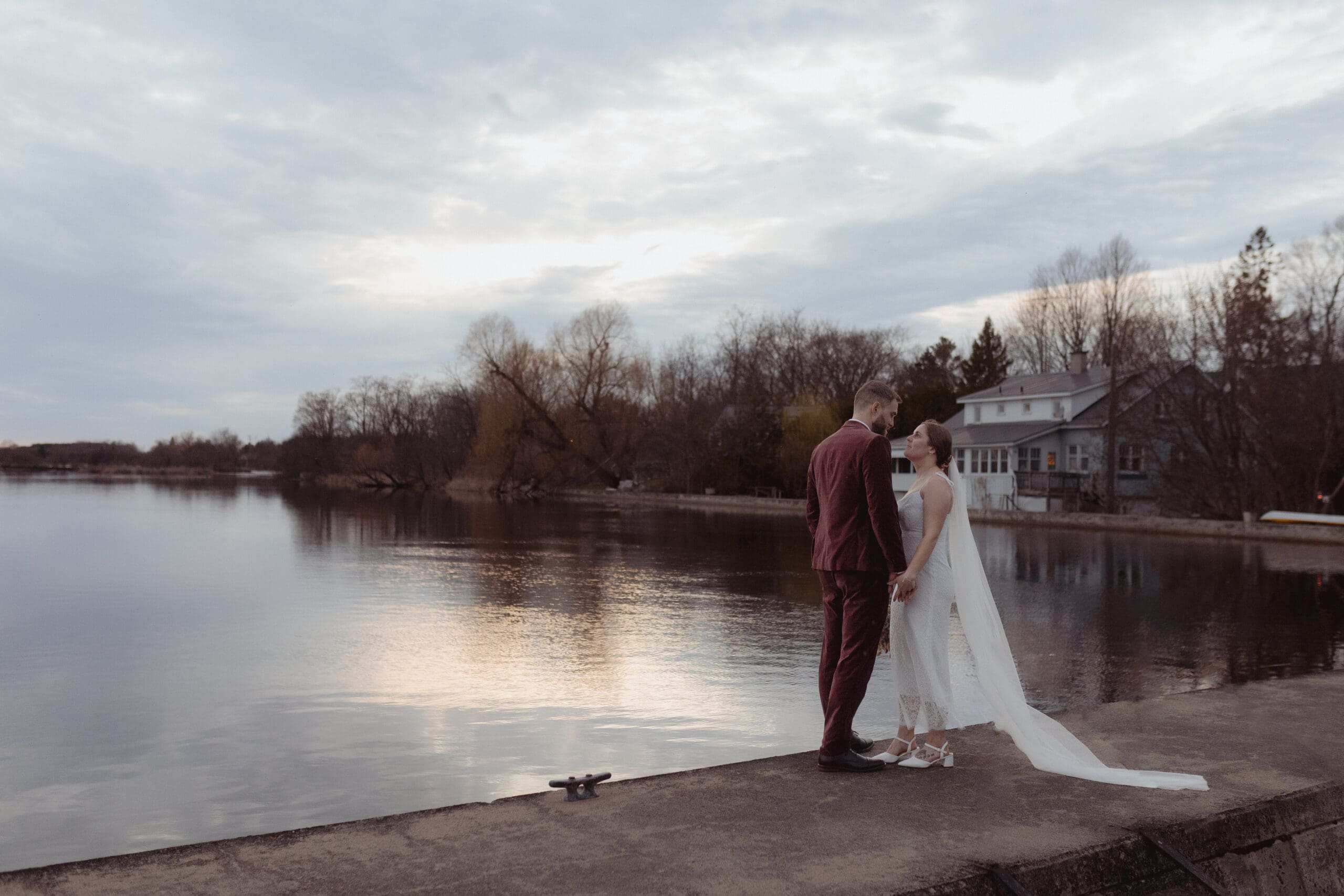 The bride and groom at sunset beside the Rideau Canal in Merrickville, Ontario.