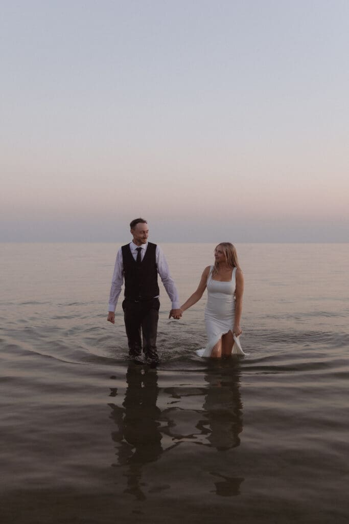 Sunset beach photos of a couple eloping in Ontario.