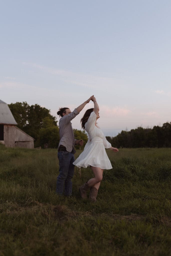 A couple dancing in a field during blue hour in Kemptville, Ontario.
