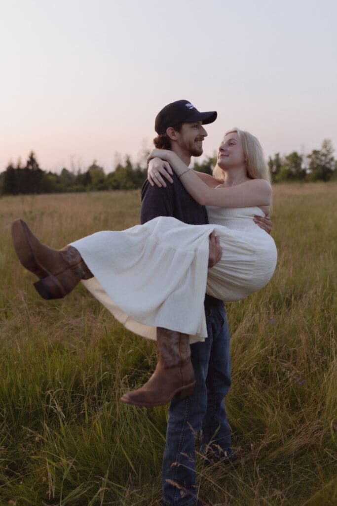 A western couple in a field.