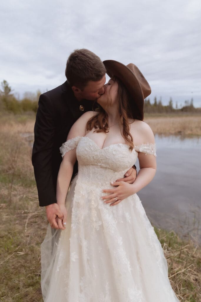A bridal couple embracing during their sunset shoot.