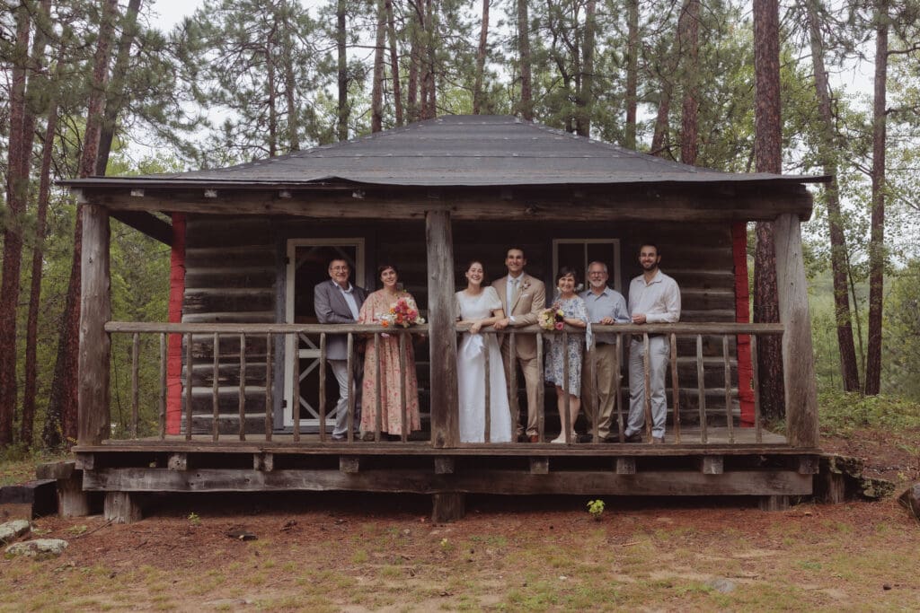 Family photos outside of the old ranger cabin for a couples intimate wedding.