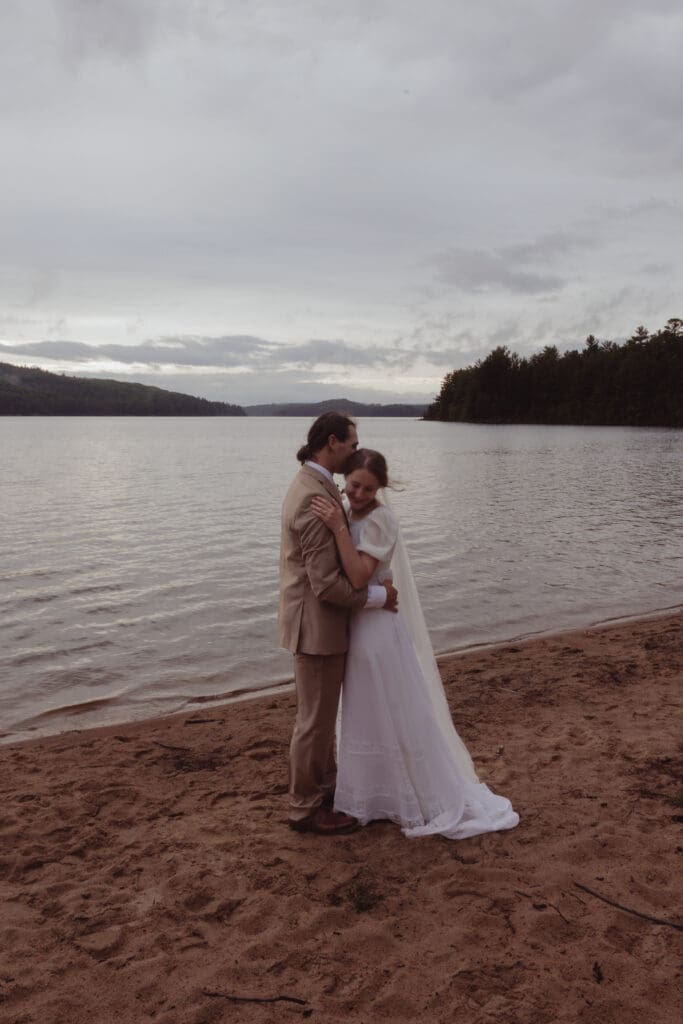 Beach photos of an elopement couple in Algonquin Park.